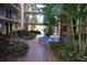 Peaceful courtyard with fountain and lush landscaping at 2699 Seville Blvd # 605, Clearwater, FL 33764