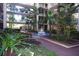 Courtyard with fountain and tropical landscaping at 2699 Seville Blvd # 605, Clearwater, FL 33764