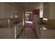 Eat-in kitchen with ample cabinet space and access to a balcony at 2699 Seville Blvd # 605, Clearwater, FL 33764