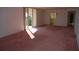 Bright living room with pink carpet and access to balcony at 2699 Seville Blvd # 605, Clearwater, FL 33764