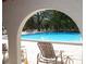 Relaxing pool area with lounge chairs and lush foliage at 2699 Seville Blvd # 605, Clearwater, FL 33764