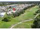 Property location shown from above near a golf course and residential area at 334 Caloosa Palms Ct, Sun City Center, FL 33573