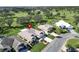 Single-story house with a landscaped yard and a golf course nearby at 334 Caloosa Palms Ct, Sun City Center, FL 33573