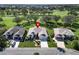 Single-story house with landscaped yard, located in a residential neighborhood near other homes at 334 Caloosa Palms Ct, Sun City Center, FL 33573