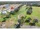 Property situated on a golf course community with a pond nearby at 334 Caloosa Palms Ct, Sun City Center, FL 33573