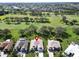 Property location shown from above, situated in a residential neighborhood near a golf course at 334 Caloosa Palms Ct, Sun City Center, FL 33573
