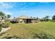 Large backyard with plenty of space for outdoor activities at 334 Caloosa Palms Ct, Sun City Center, FL 33573