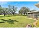 Landscaped backyard with golf course views at 334 Caloosa Palms Ct, Sun City Center, FL 33573