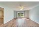 Spacious bedroom with wood-look flooring and large windows at 334 Caloosa Palms Ct, Sun City Center, FL 33573