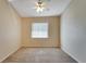 Well-lit bedroom with carpeted floors and ceiling fan at 334 Caloosa Palms Ct, Sun City Center, FL 33573