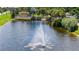 Community entrance with a fountain and signage, showcasing attractive landscaping at 334 Caloosa Palms Ct, Sun City Center, FL 33573
