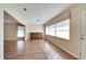 Bright dining room with wood-look floors and built-in hutch at 334 Caloosa Palms Ct, Sun City Center, FL 33573