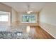 Bright dining area with hardwood floors and large window at 334 Caloosa Palms Ct, Sun City Center, FL 33573