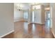 Bright and airy entryway with hardwood flooring and chandelier at 334 Caloosa Palms Ct, Sun City Center, FL 33573