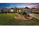 Beautiful home with landscaped lawn, attractive curb appeal, and a two-car garage at 334 Caloosa Palms Ct, Sun City Center, FL 33573