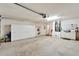 Garage with storage cabinets and overhead door opener at 334 Caloosa Palms Ct, Sun City Center, FL 33573