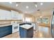 Open kitchen with island and updated appliances at 334 Caloosa Palms Ct, Sun City Center, FL 33573