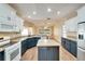 Updated kitchen with granite countertops, stainless steel appliances, and stylish cabinetry at 334 Caloosa Palms Ct, Sun City Center, FL 33573