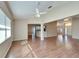 Sunlit living room, open to kitchen and dining area at 334 Caloosa Palms Ct, Sun City Center, FL 33573
