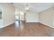 Open concept living room with hardwood flooring and ceiling fan at 334 Caloosa Palms Ct, Sun City Center, FL 33573