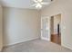 Bright office with carpet flooring and French doors at 334 Caloosa Palms Ct, Sun City Center, FL 33573