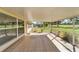 Relaxing screened porch overlooking the golf course at 334 Caloosa Palms Ct, Sun City Center, FL 33573