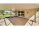 Covered screened porch with access to backyard at 334 Caloosa Palms Ct, Sun City Center, FL 33573