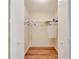Good-sized walk-in closet with hanging rods and shelving at 334 Caloosa Palms Ct, Sun City Center, FL 33573