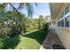 Landscaped side yard with walkway and grass at 3873 21St N Ave, St Petersburg, FL 33713