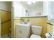 Retro style bathroom with yellow tile and shower at 3873 21St N Ave, St Petersburg, FL 33713