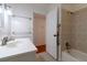 Bathroom with shower and tub combination with open door to hallway at 3873 21St N Ave, St Petersburg, FL 33713