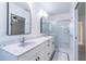 Clean bathroom, double vanity, and a shower stall at 3873 21St N Ave, St Petersburg, FL 33713