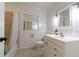 Clean bathroom with white vanity, bathtub, and shower at 3873 21St N Ave, St Petersburg, FL 33713