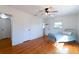 Hardwood floor bedroom with window and access to bathroom at 3873 21St N Ave, St Petersburg, FL 33713