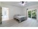 Bright bedroom with sliding glass doors to backyard, featuring a queen bed at 3873 21St N Ave, St Petersburg, FL 33713
