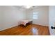 Simple bedroom with hardwood floors, a ceiling fan, and a window at 3873 21St N Ave, St Petersburg, FL 33713
