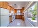Kitchen with light wood cabinets and white appliances at 3873 21St N Ave, St Petersburg, FL 33713