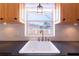 Kitchen sink with white farmhouse sink and updated faucet at 3873 21St N Ave, St Petersburg, FL 33713
