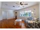 Bright living room with hardwood floors, floral sofa, and ample natural light at 3873 21St N Ave, St Petersburg, FL 33713