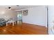 Open concept living area with hardwood floors and views to dining area at 3873 21St N Ave, St Petersburg, FL 33713