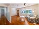 Bright living room with hardwood floors, large windows, ceiling fan, and a cozy sitting area with a modern couch at 3873 21St N Ave, St Petersburg, FL 33713