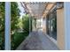 Covered patio with adjacent grassy area and lush hedges at 3873 21St N Ave, St Petersburg, FL 33713