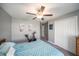 Bedroom with ceiling fan and plenty of closet space at 39822 Harmon Grove Ct, Zephyrhills, FL 33540