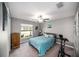 Cozy bedroom with a ceiling fan and exercise bike at 39822 Harmon Grove Ct, Zephyrhills, FL 33540