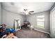 Bedroom with ceiling fan and ample storage space at 39822 Harmon Grove Ct, Zephyrhills, FL 33540