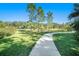 Community dog park with a walking path at 39822 Harmon Grove Ct, Zephyrhills, FL 33540