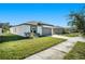 New construction home with grassy yard at 39822 Harmon Grove Ct, Zephyrhills, FL 33540