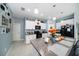 Modern kitchen with white cabinets, granite countertops, and stainless steel appliances at 39822 Harmon Grove Ct, Zephyrhills, FL 33540