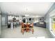 Open concept kitchen with white cabinets and island at 39822 Harmon Grove Ct, Zephyrhills, FL 33540