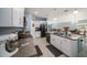 Modern kitchen with white cabinets, granite countertops and island at 39822 Harmon Grove Ct, Zephyrhills, FL 33540